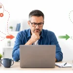 Beginner reviewing common affiliate marketing mistakes on a laptop.